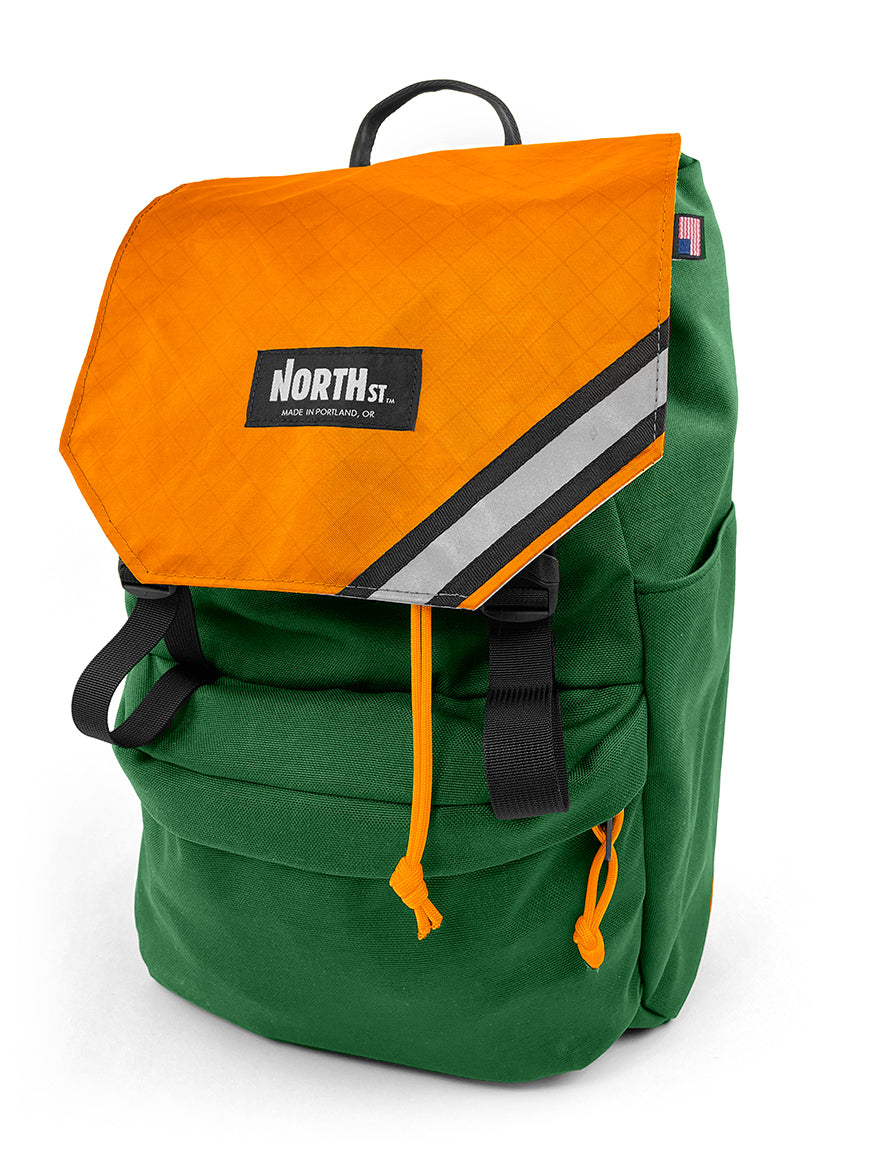 front view of belmont backpack in forest green and orange