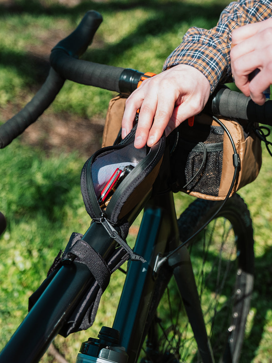Detail view of Fuel Pouch mounted to bicycle with items inside. - North St Bags all-groups