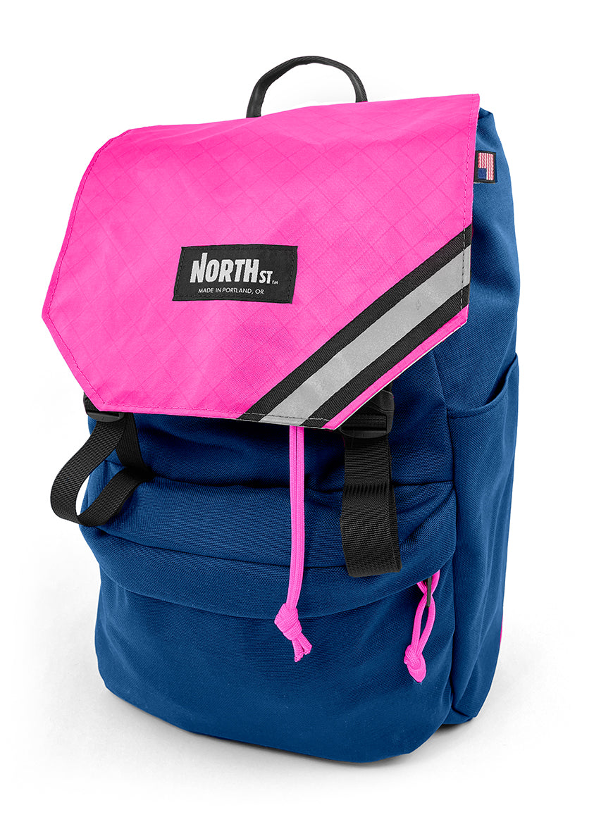 front view of belmont backpack in midnight blue and pink