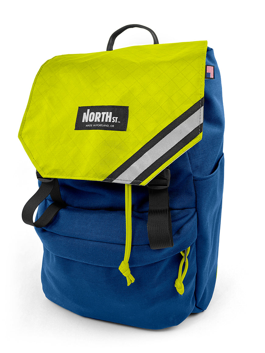 front view of belmont backpack in midnight blue and bright yellow