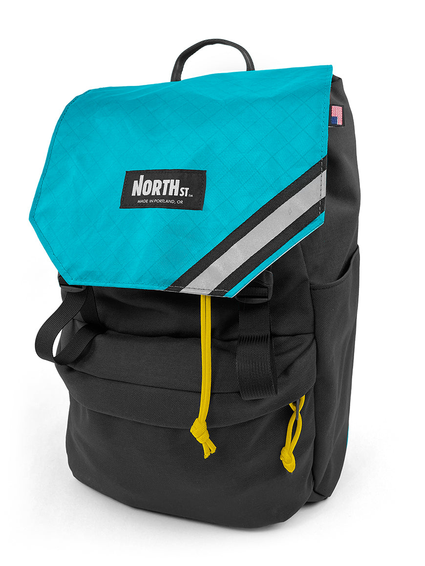 Front view of stylish backpack pannier in black and teal. Morrison Backpack Pannier 22L - North St. Bags