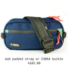 front view of Eliot Sling Pack with COBRA buckle strap in midnight & evergreen