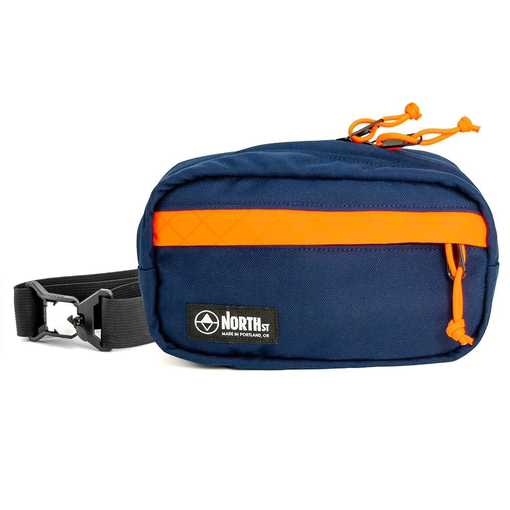 pioneer 9 hip pack in midnight with orange accent and north st label