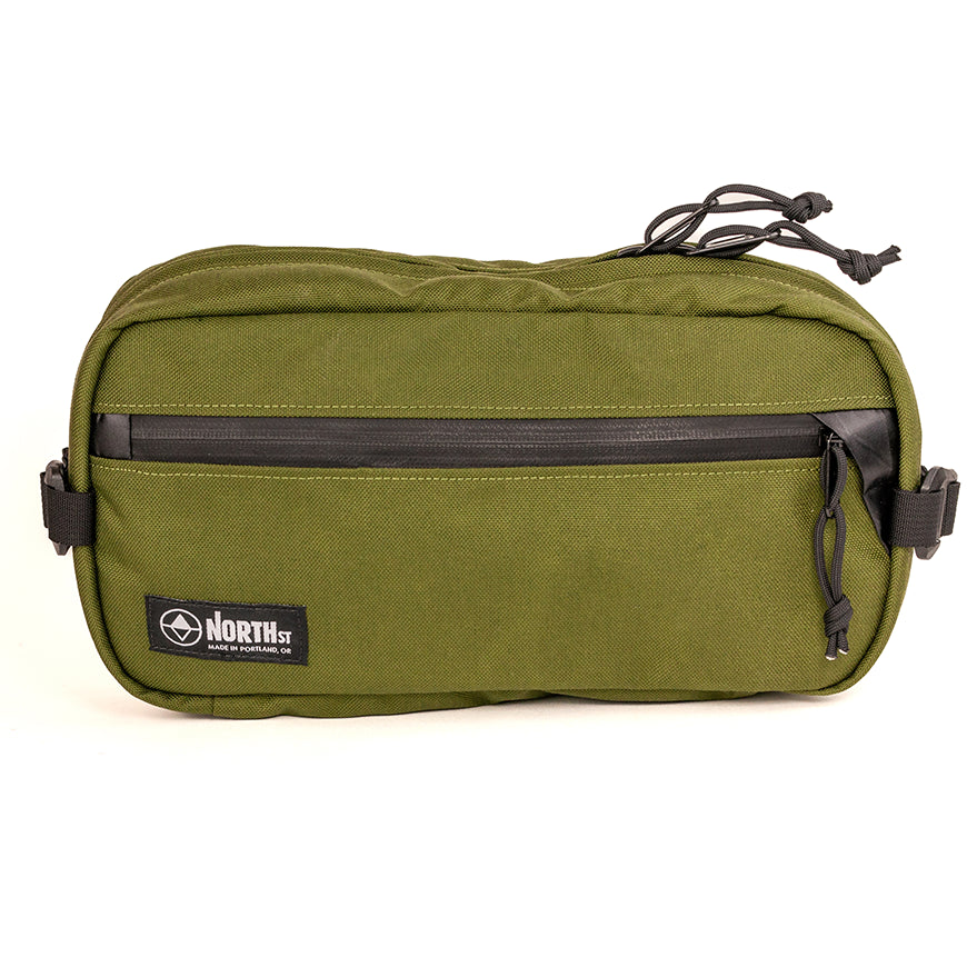 front view of sling pack by North St in olive