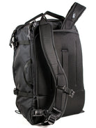 Back view of a black travel backpack showing stow-able backpack straps and carry handles on a white background. 